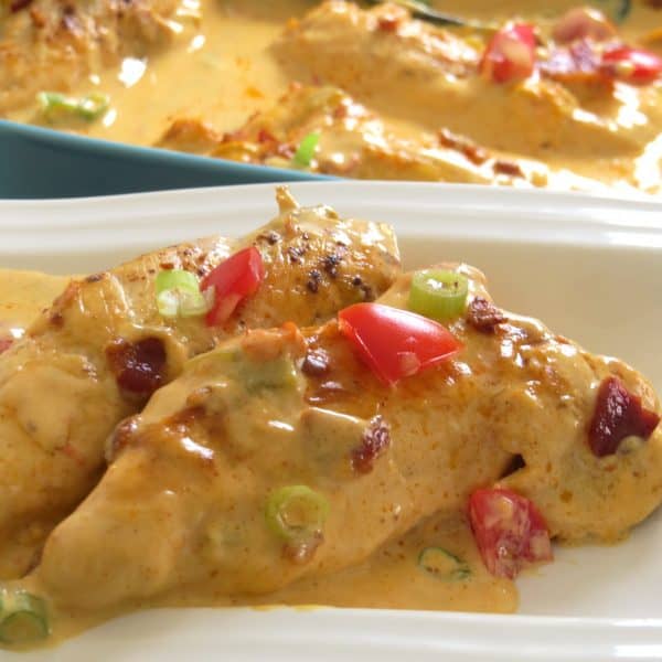 on a white plate with con queso sauce