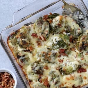 brussel sprouts keto recipe with a scoop of the cheesy brussel sprouts on a spoon