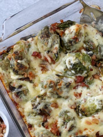 brussel sprouts keto recipe with a scoop of the cheesy brussel sprouts on a spoon