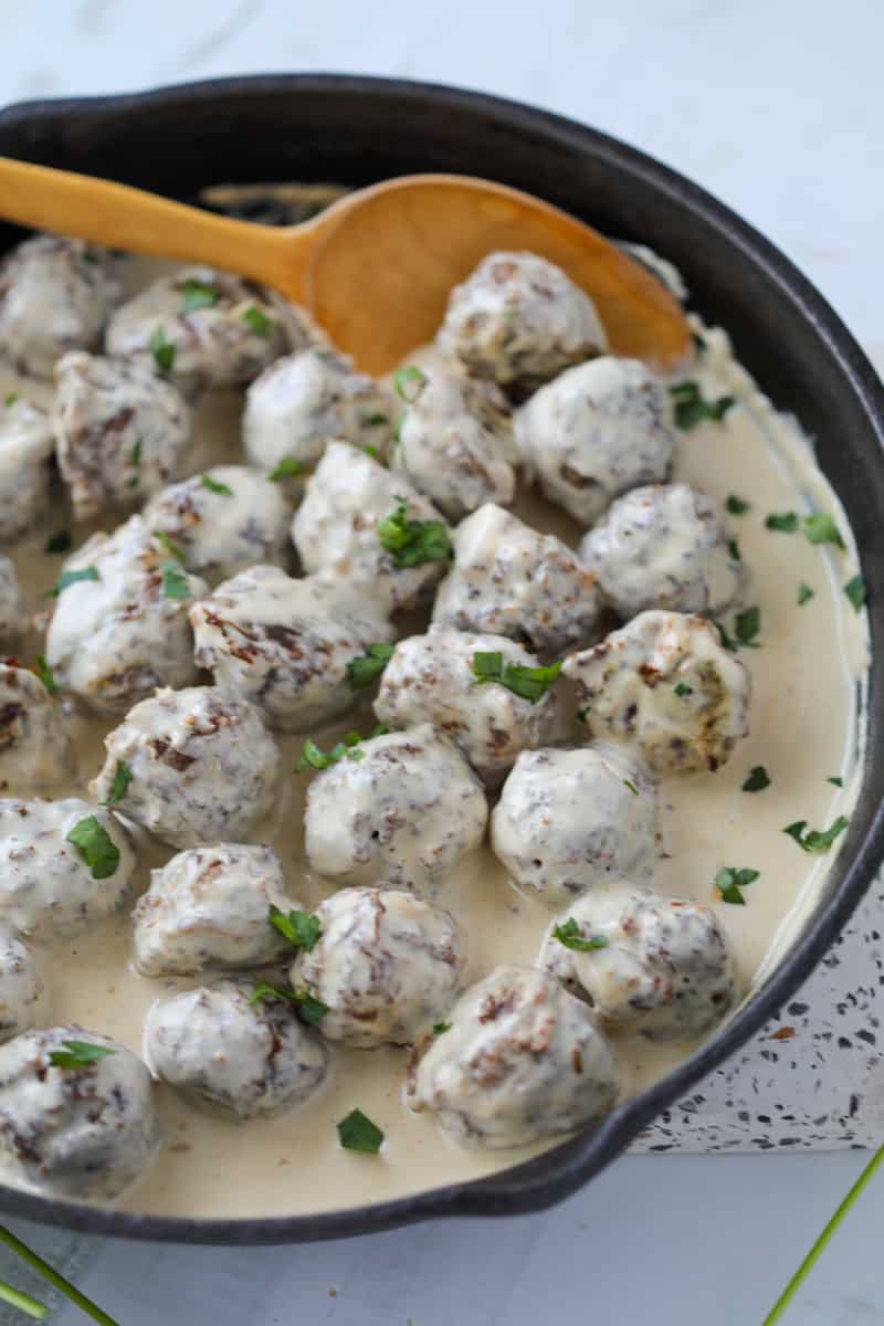 low carb swedish meatballs in a skillet covered in sauce