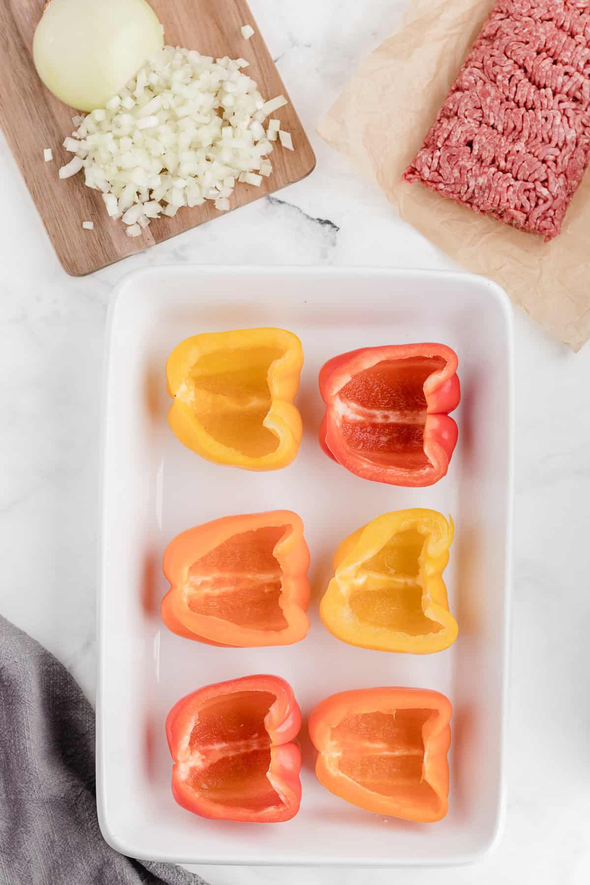 prep the bell peppers and place them in a baking pan