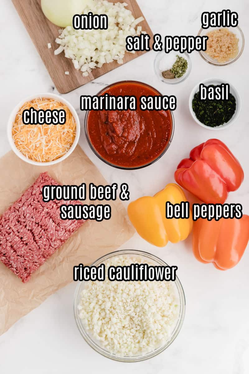 ingredients for stuffed peppers with cauliflower rice on a cutting board