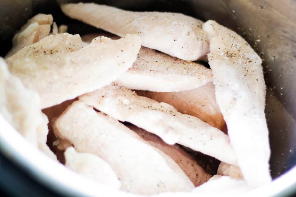 frozen chicken in instant pot with seasoning before cooking
