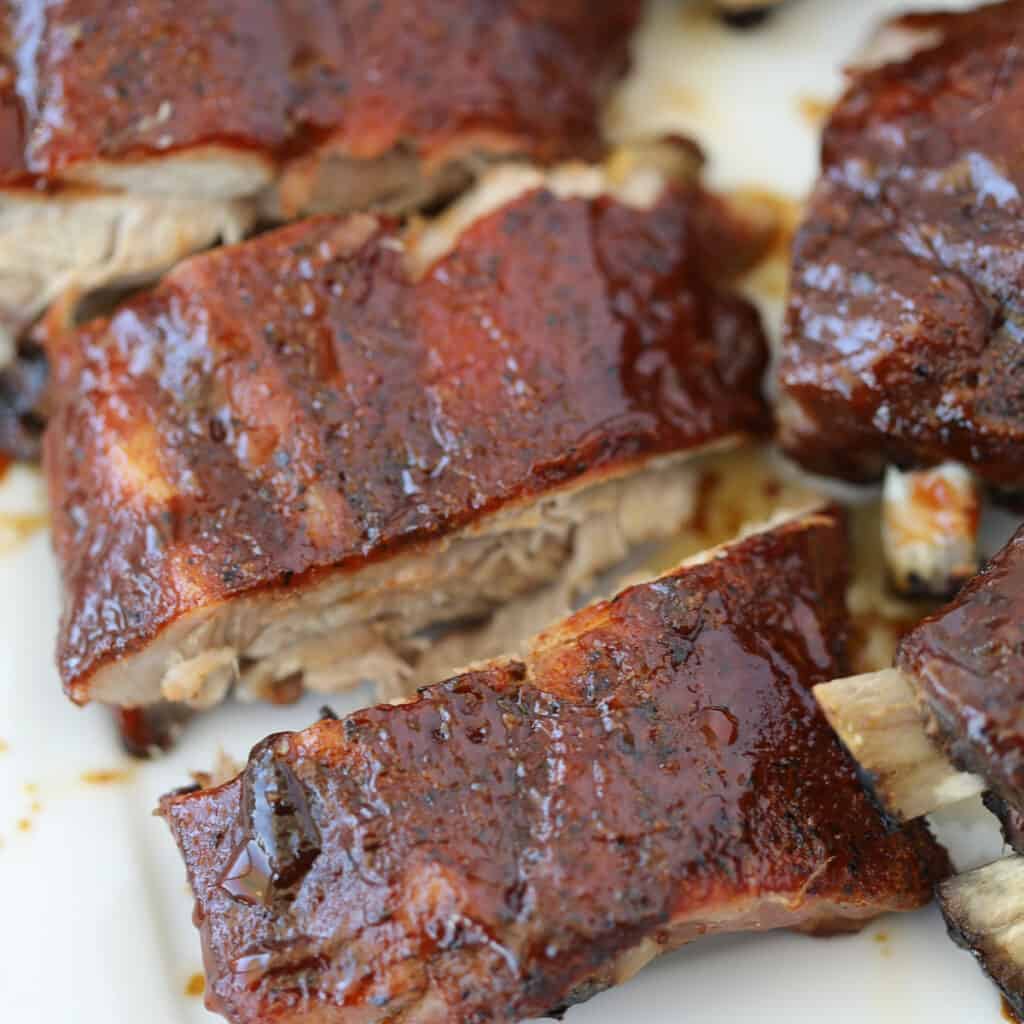 baked ribs cooked in the oven with sauce and cut after getting baked