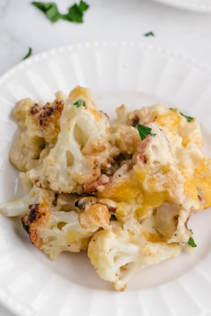 keto cauliflower casserole recipe on a white plate ready to eat