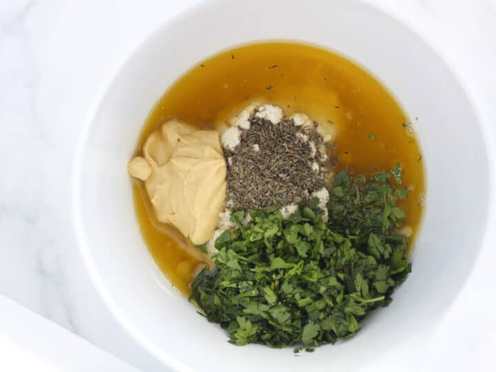 mustard crusted pork chops coating in a bowl