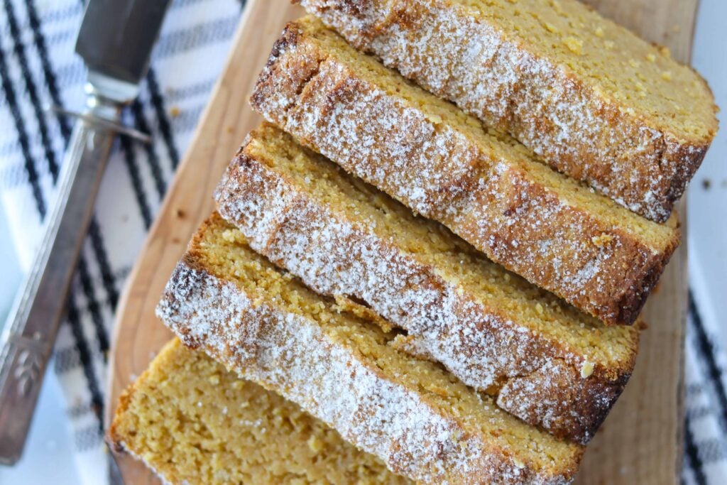low carb pumpkin bread sliced after cooking on a cutting board