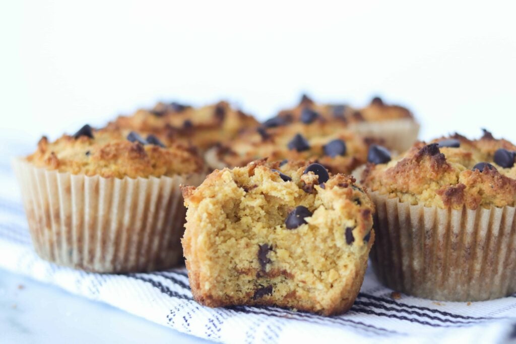 keto pumpkin muffins cooling with a bite out of the muffinnn