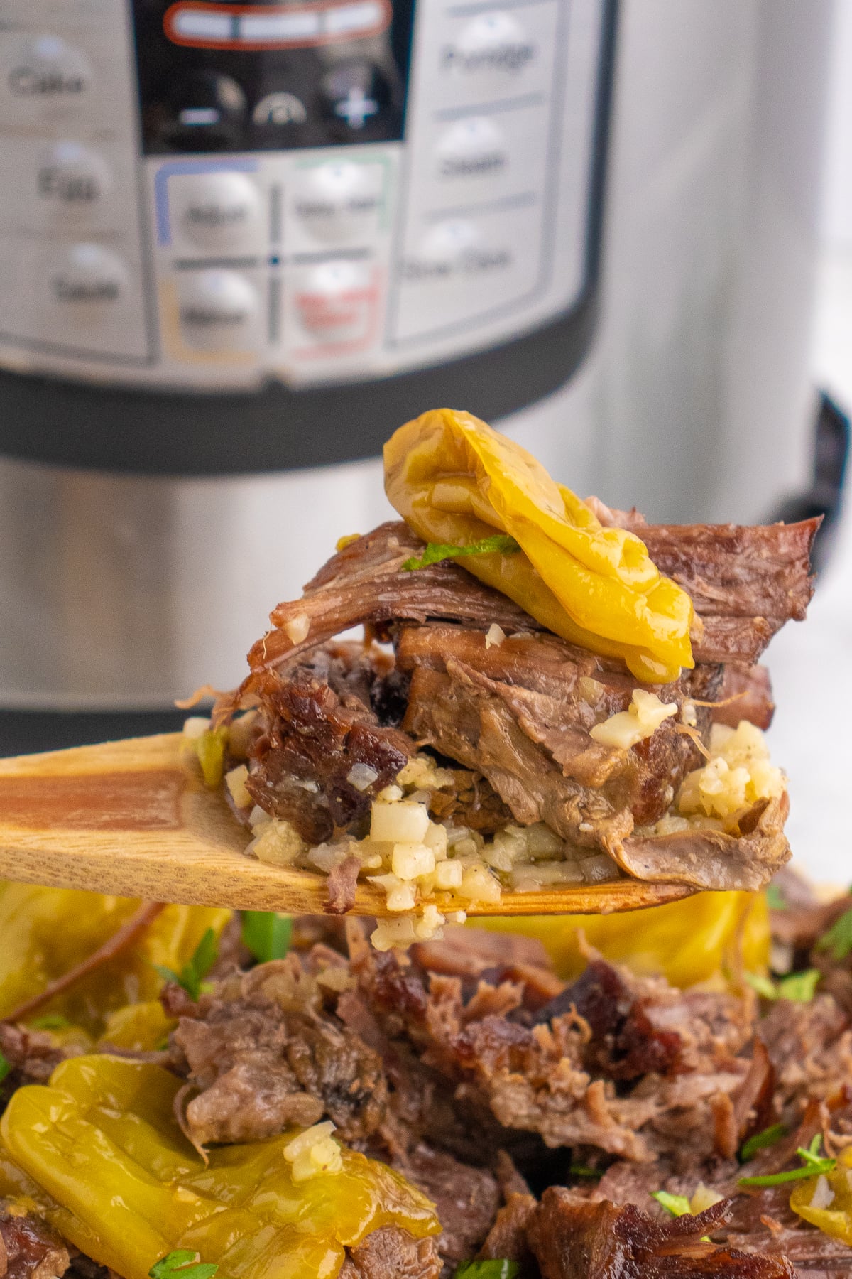 shredded beef on a fork with peppers and rice