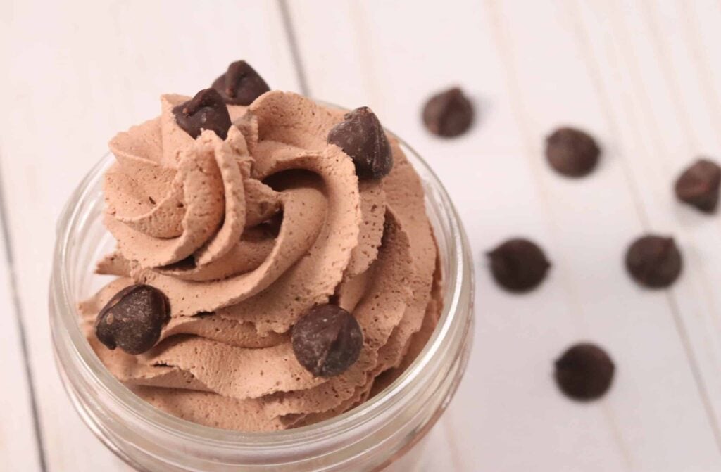 keto chocolate mousse easy no bake recipe sprinkled with chocolate chips in a mason jar
