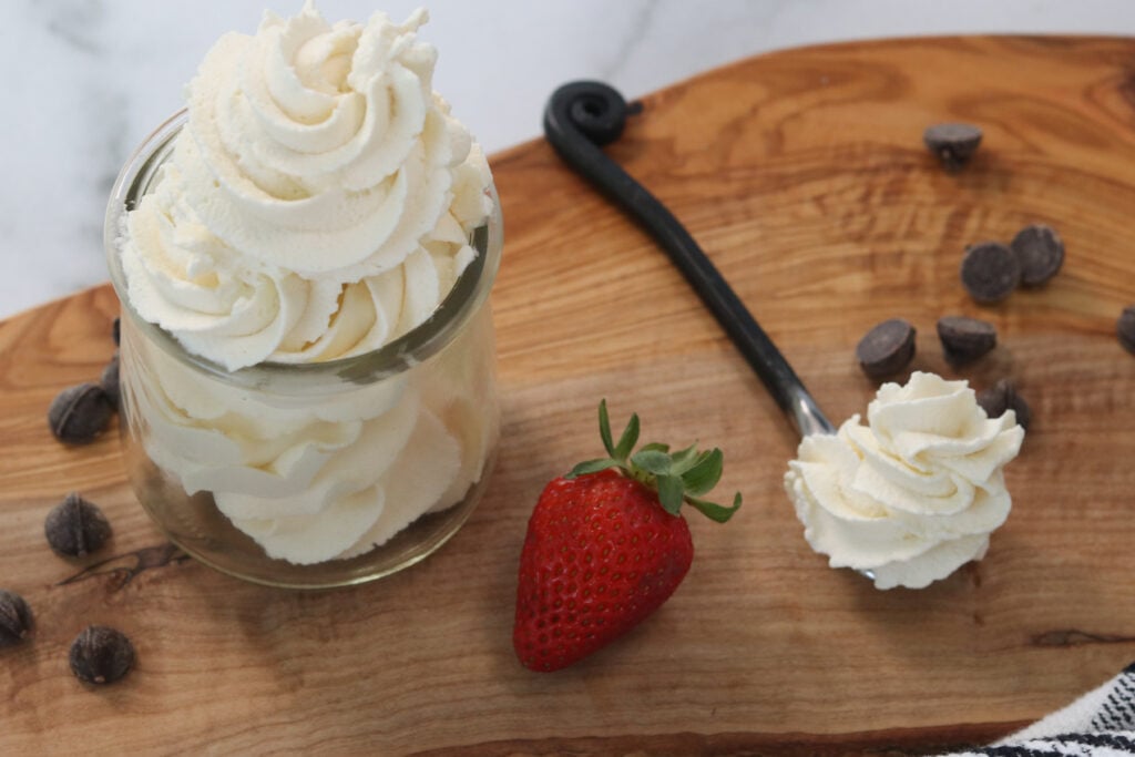 stevia whipped cream in a cup with a  bite on a spoon