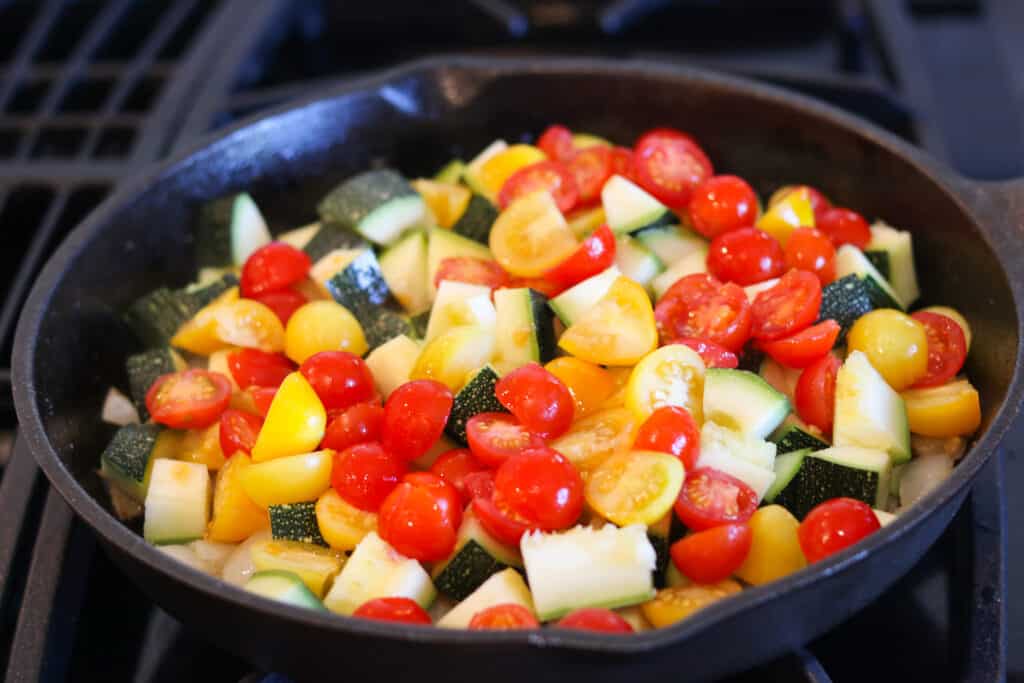 The first step in making vegan thai curry is to cook the vegetables. Photo shows the veggies before they've started cooking in a pot.