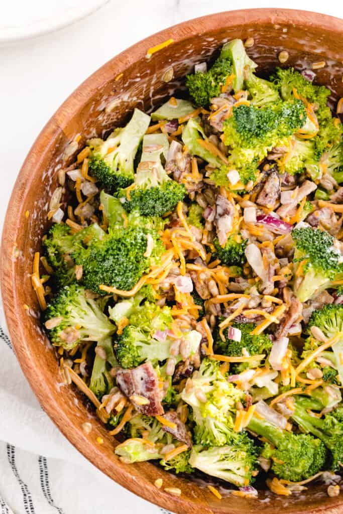 the low carb broccoli salad mixed in a large wooden bowl