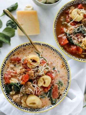 sausage tortellini soup crock pot recipe in two bowls, one creamy and one without cream