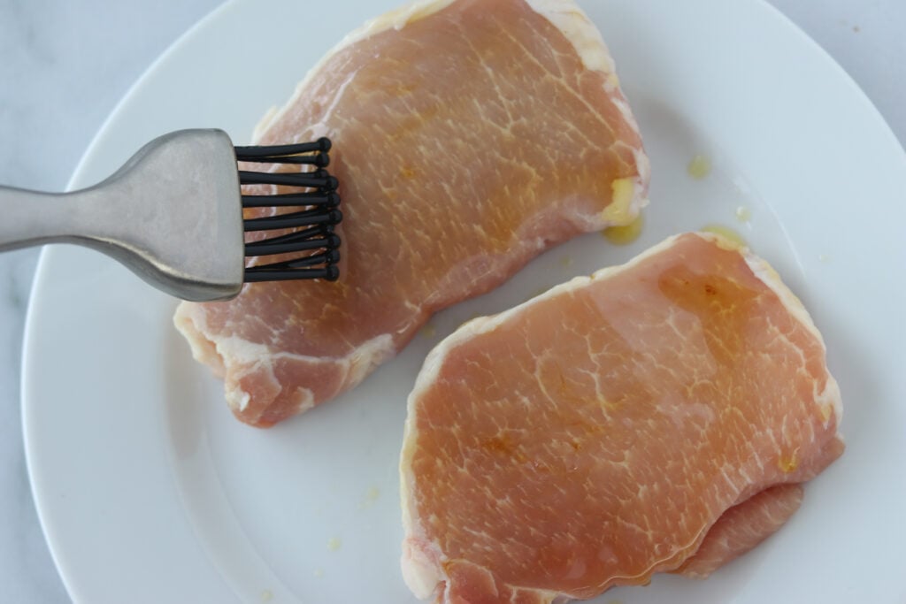 brush oil on air fryer boneless pork chops