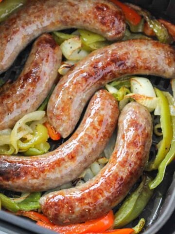 air fryer brats in an air fryer basket