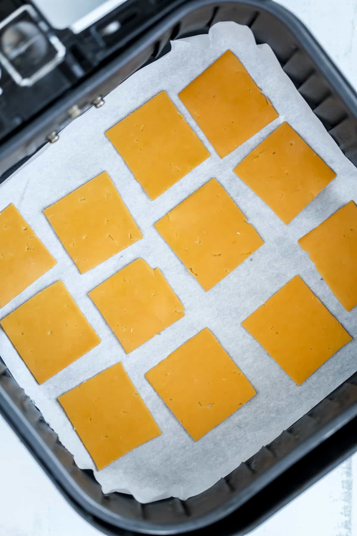 making cheese crisps in an air fryer basket