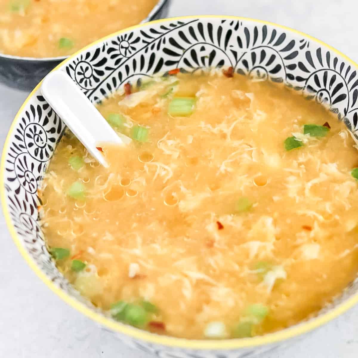 the simple gluten free egg drop soup no corn starch recipe in an asian bowl ready to eat