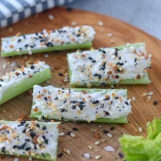 recipe for stuffed celery completed on a cutting board with Everything seasoning