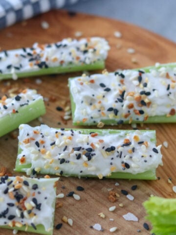recipe for stuffed celery completed on a cutting board with Everything seasoning