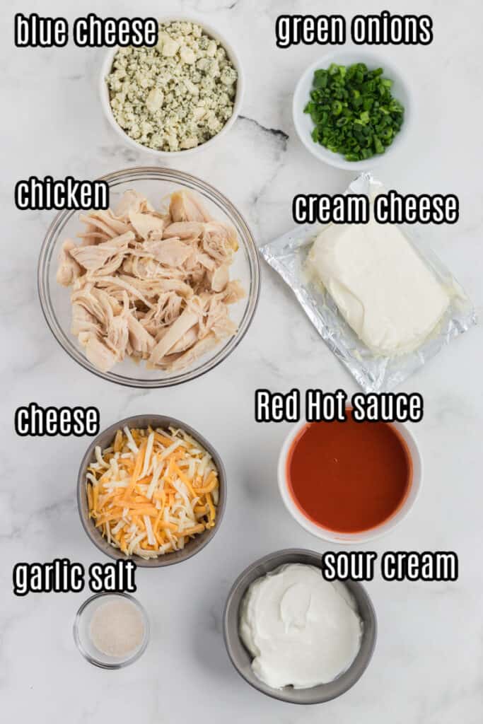 shredded chicken dip ingredients on a white tray
