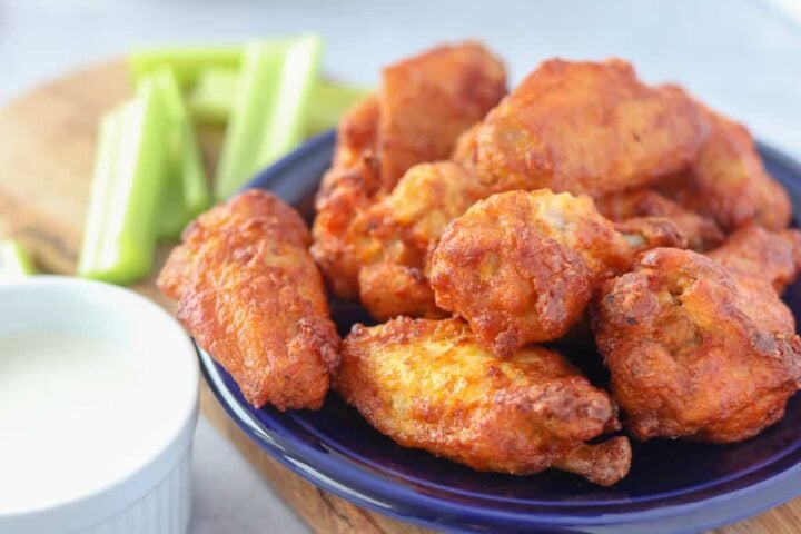 air fryer frozen chicken wings on a blue plate