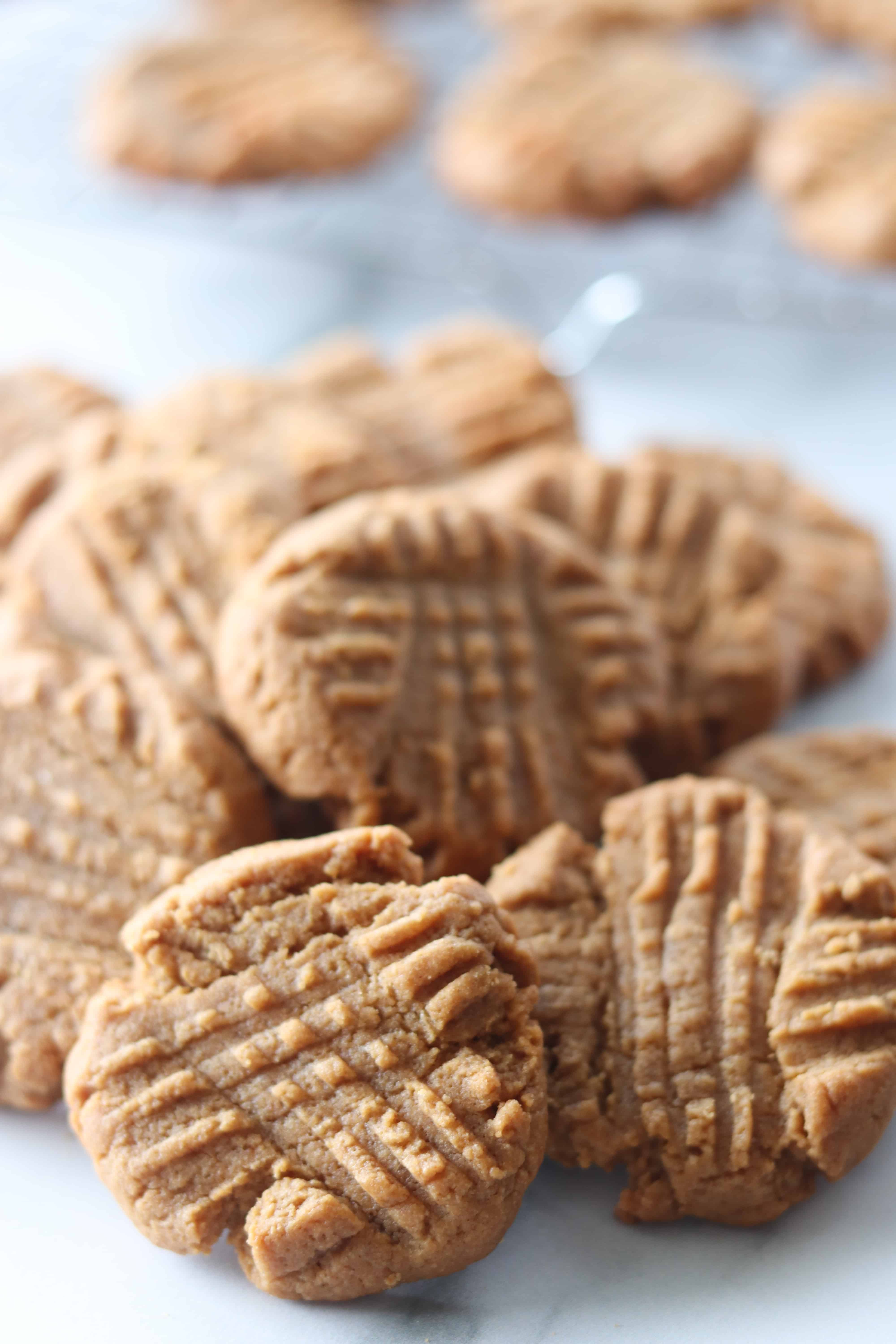 gluten free dairy free cookies stacked on a white background