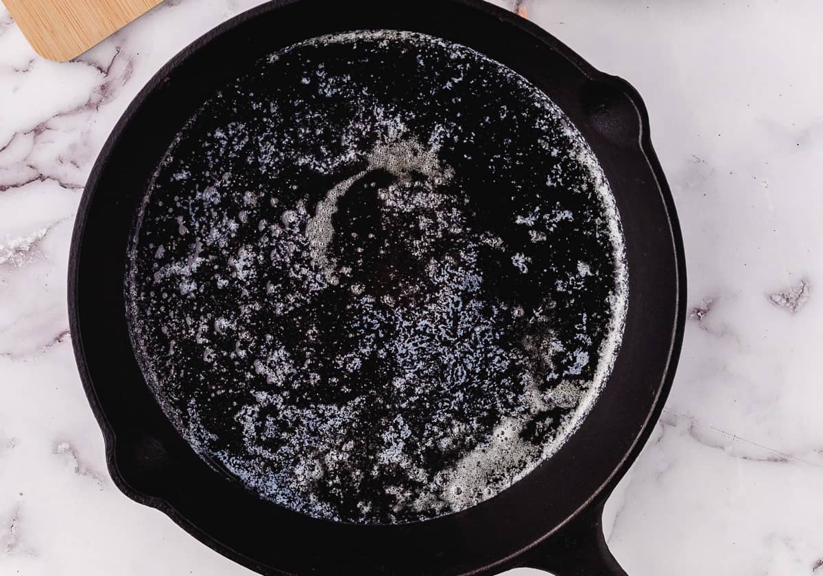 heating oil in a skillet for sauteed chicken tenderloins