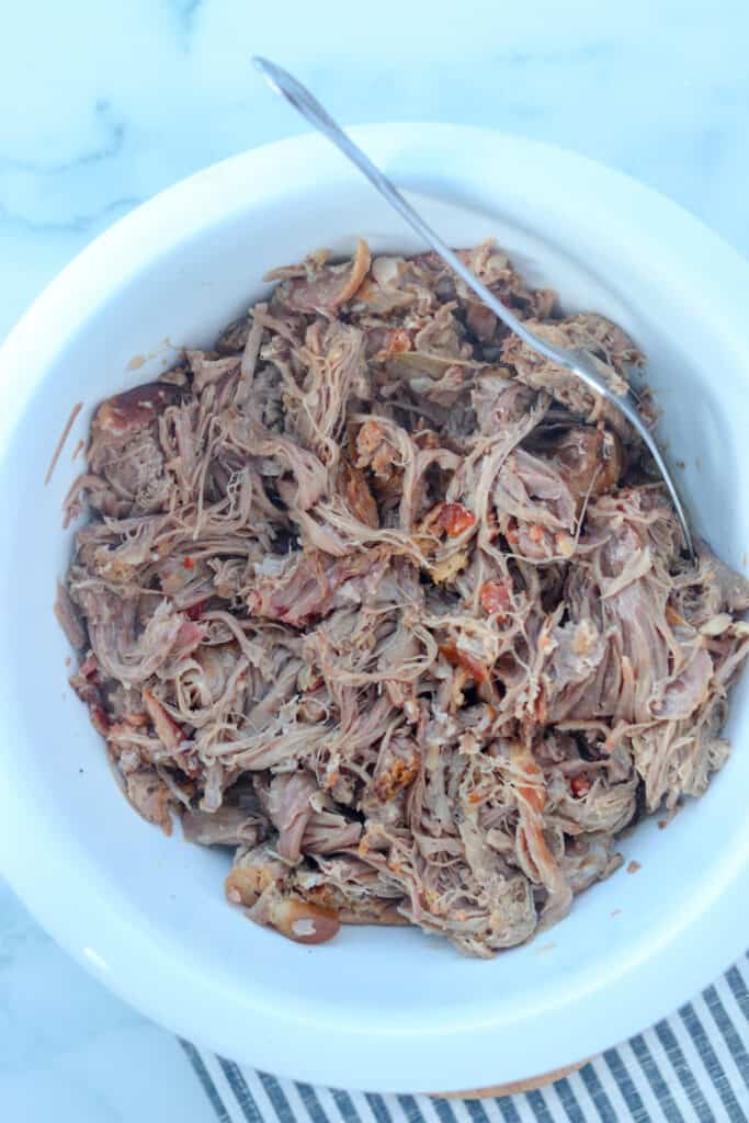 put the slow cooker kalua pork in a bowl to shred