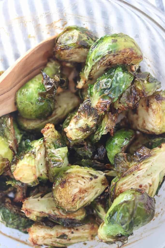 air fryer brussel sprouts in a bowl after cooking with balsamic