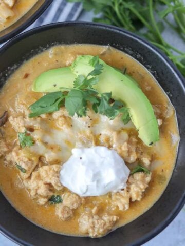 keto chicken chili with two bowls of chili ready to eat