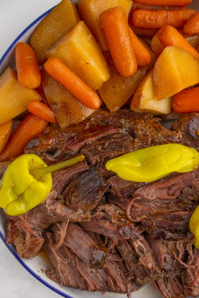 mississippi pot roast with potatoes and carrots after cooking on a platter