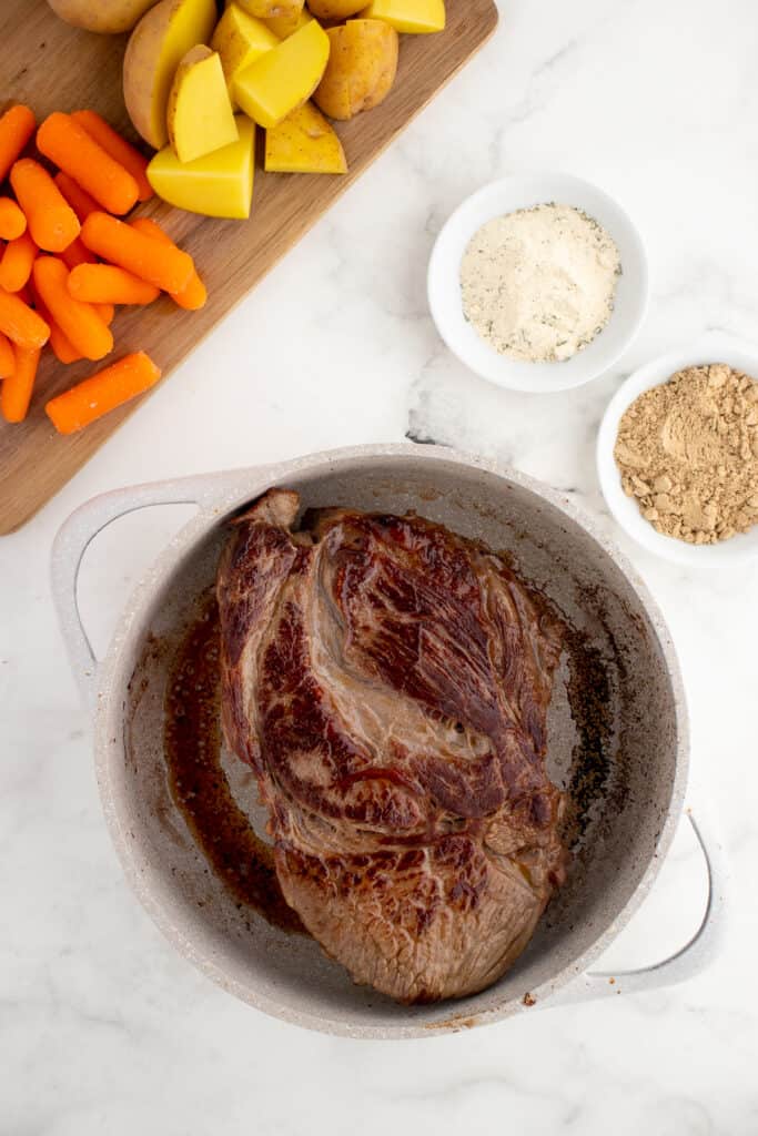 sear the beef in a skillet before making Mississippi pot roast with pepperoncini peppers