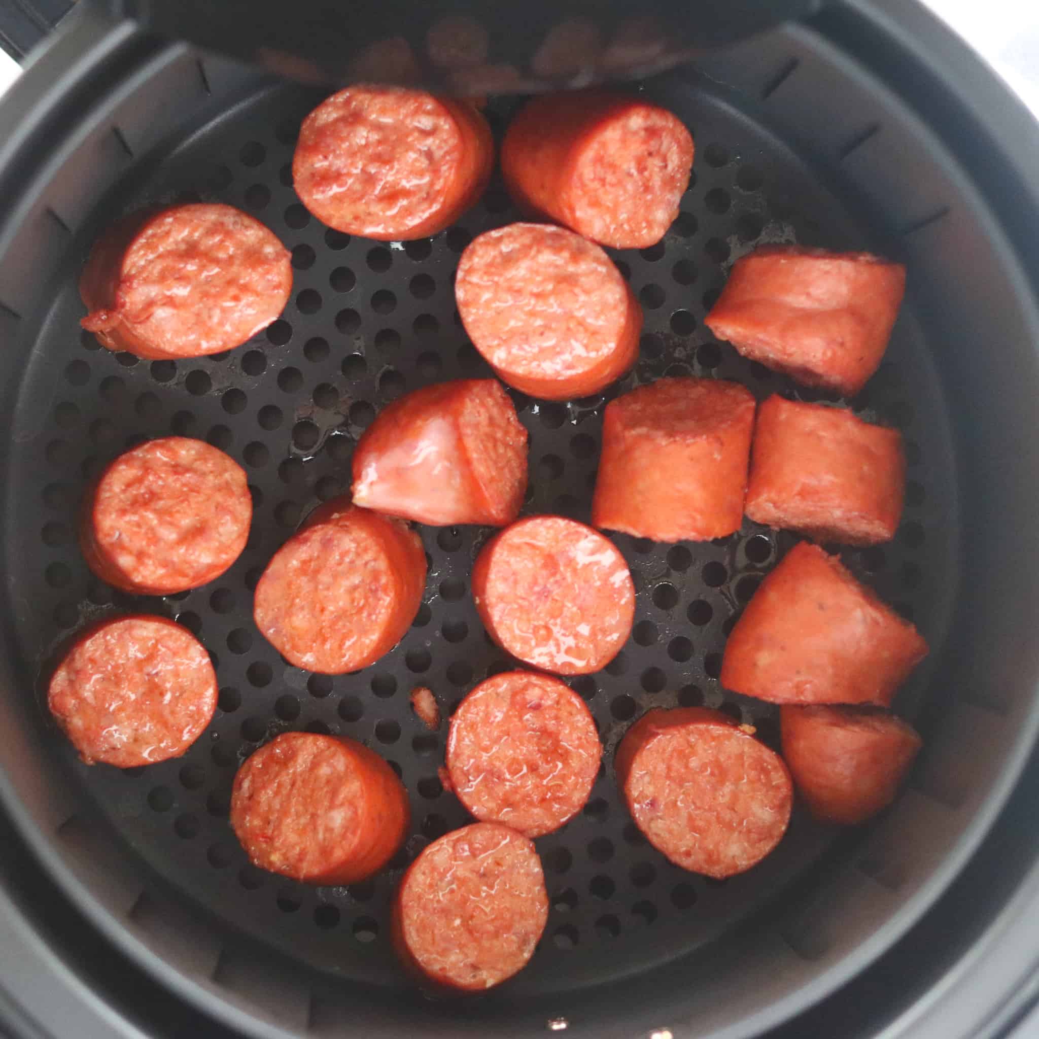 air fryer kielbasa cooked in the pot looking down view