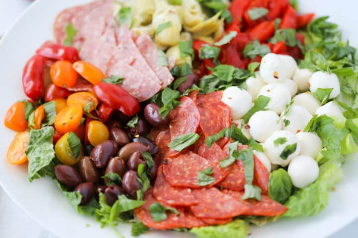 antipasto salad keto in a bowl before drizzling the dressing