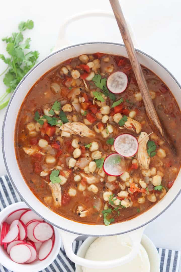 a pot of chicken pozole soup in a dutch oven