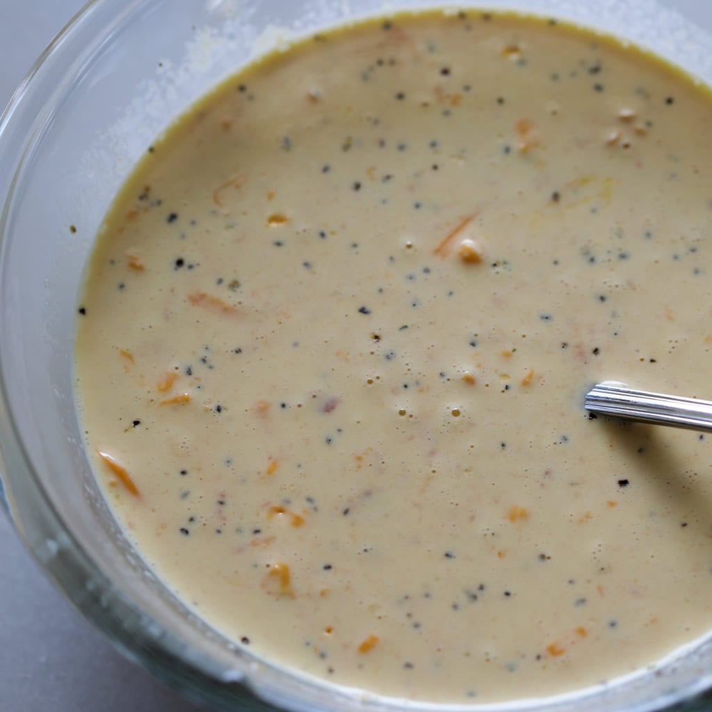 mixing the taco pie egg filling in a medium size mixing bowl