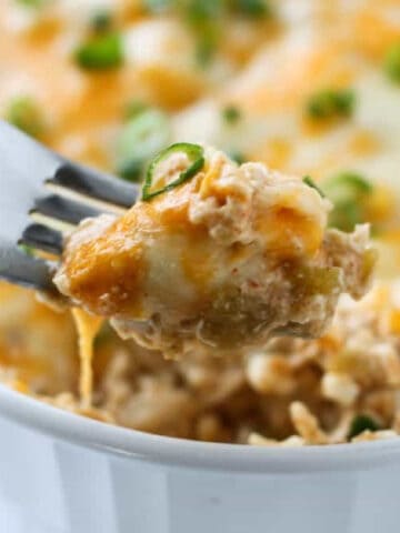 a bite of green chili casserole on a fork