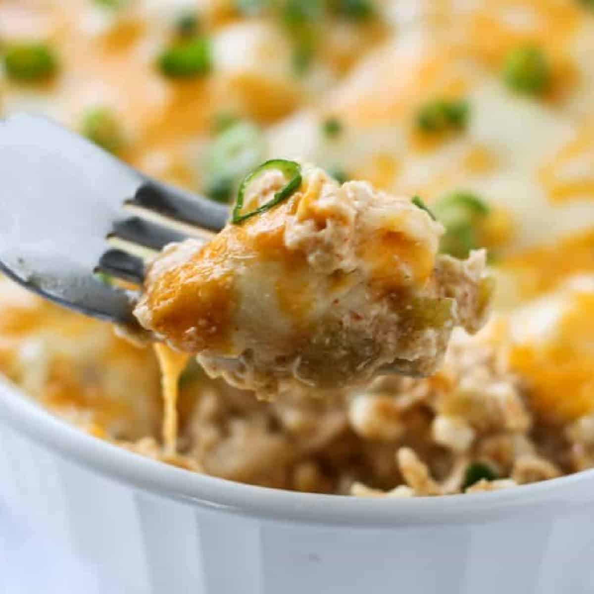 a bite of green chili casserole on a fork