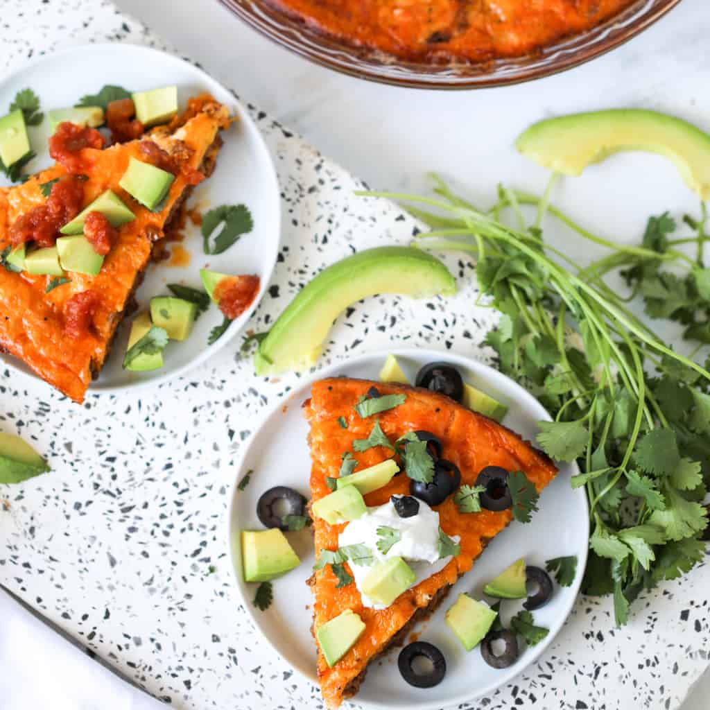 low carb taco pie crustless on a white cutting board