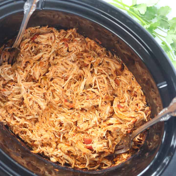 slow cooker mexican shredded chicken in a crockpot after getting shredded