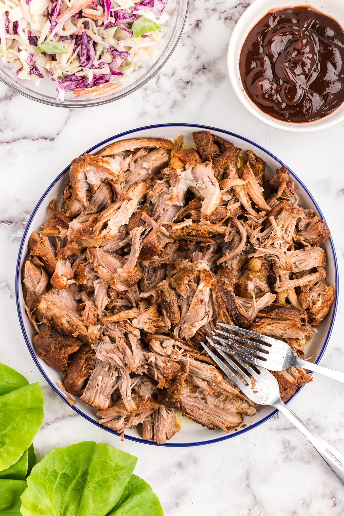 pulled pork shredded in a bowl with bbq sauce