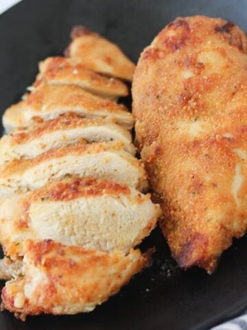 air fryer breaded chicken breast on a plate after cooking