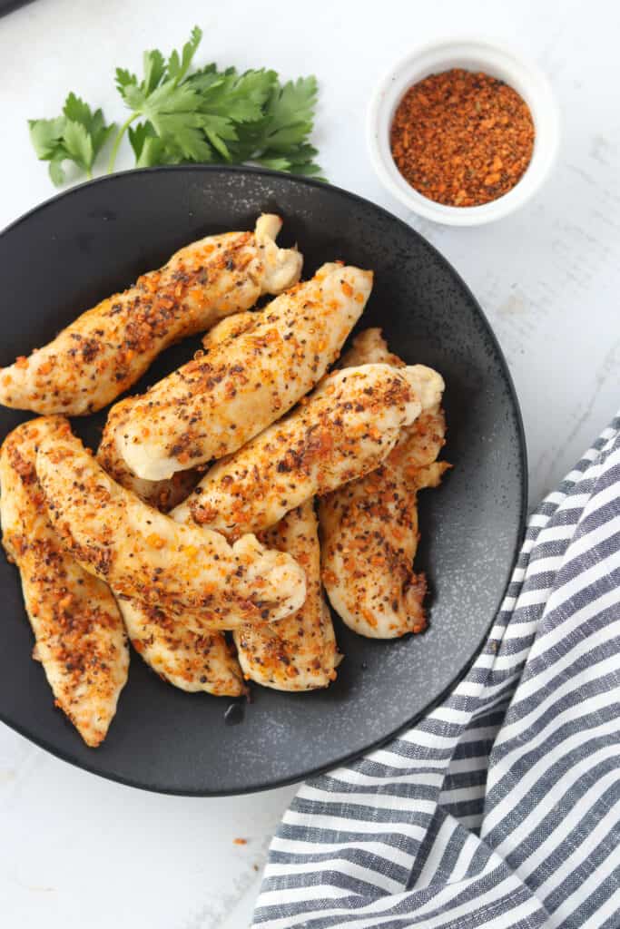 air fryer chicken tenderloins on a plate ready to eat