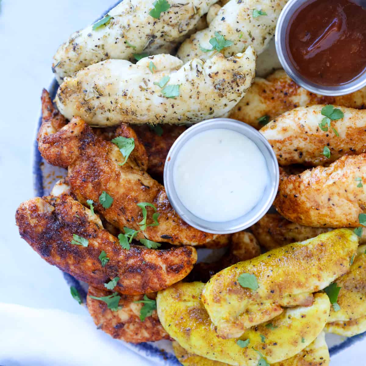 air fryer chicken tenders no breading on a plate and cooked