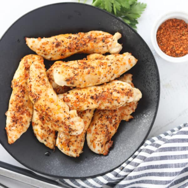 air fryer chicken tenders no breading on a plate and cooked