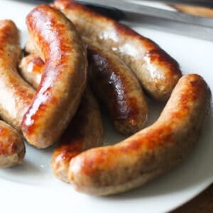 how to cook bratwurst with a plate of cooked brats golden brown