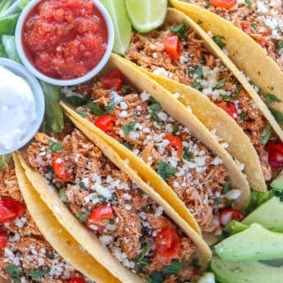 instant pot chicken tacos with garnishes on a platter