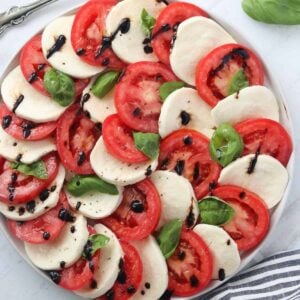 recipe for caprese salad with the final dish on a platter