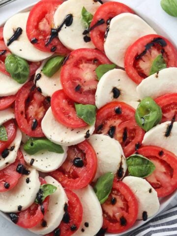 recipe for caprese salad with the final dish on a platter